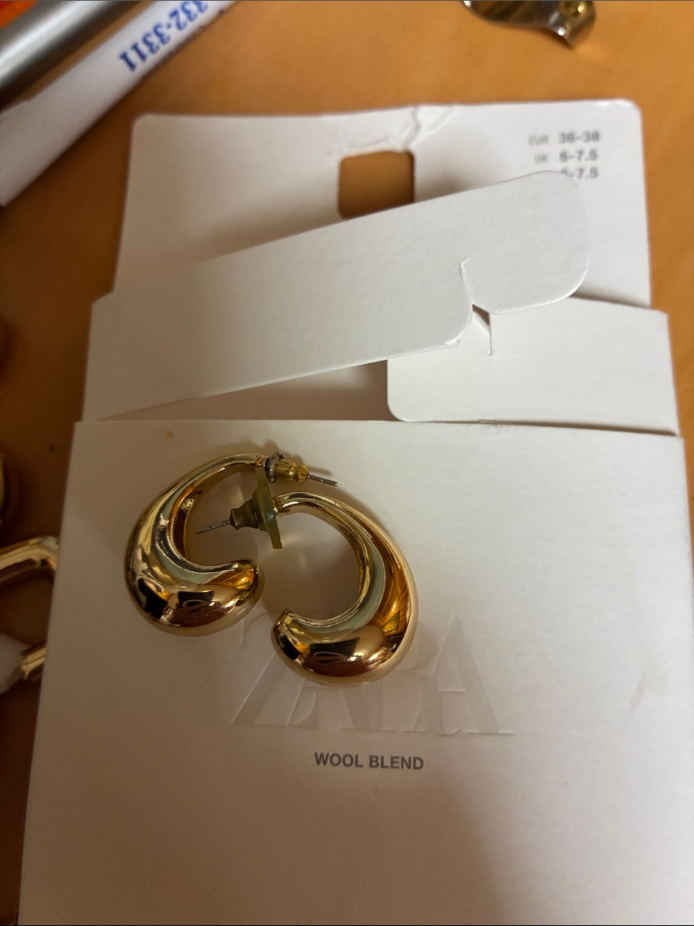 Zara Polished Gold Crescent Hoop Earrings